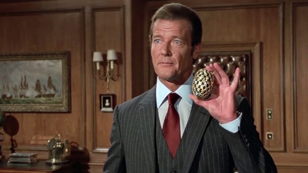 Zdjęcie okładkowe wpisu: Roger Moore z zbezczeszczonym nagrobkiem. Pomnik aktora został okradziony